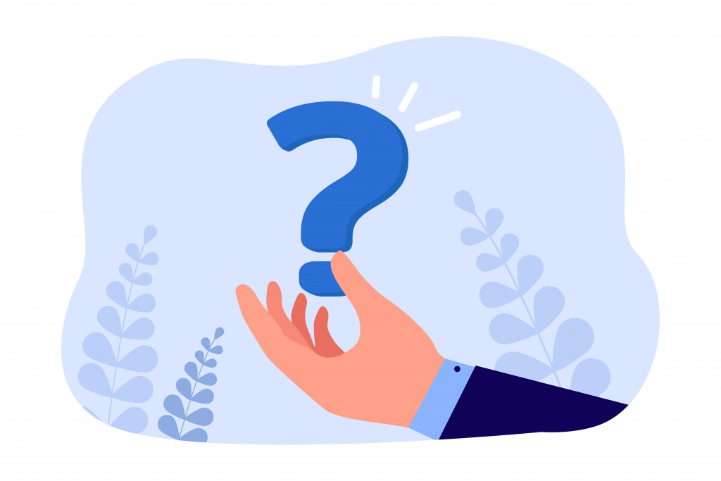 Businessmans hand holding question mark.jpg